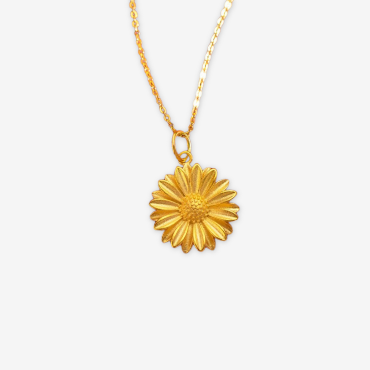 Collana dorata con pendente a forma di sole