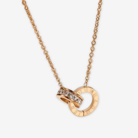 Collana in acciaio al titanio placcato oro.