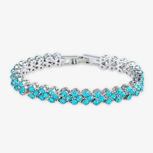 Bracciale tennis azzurro a forma di cuore.