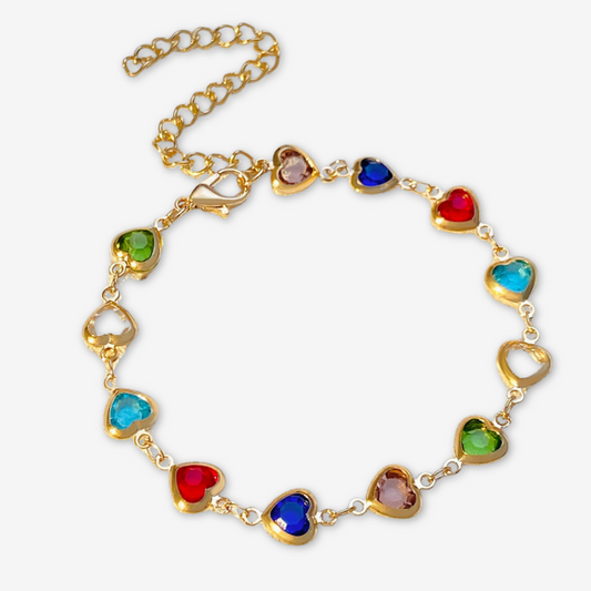 Bracciale oro con cuori di colore vario.