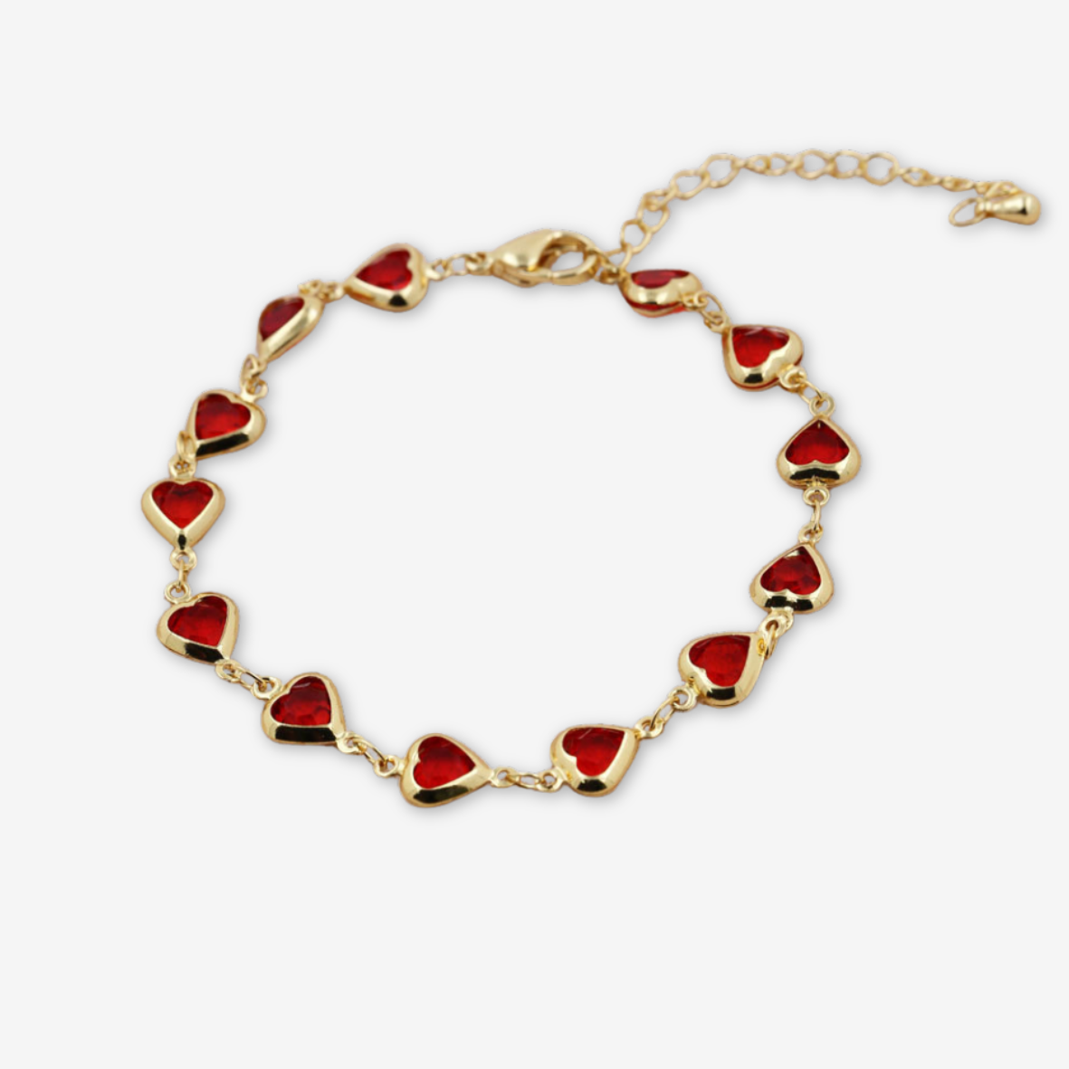 Bracciale color oro con cuori rossi.