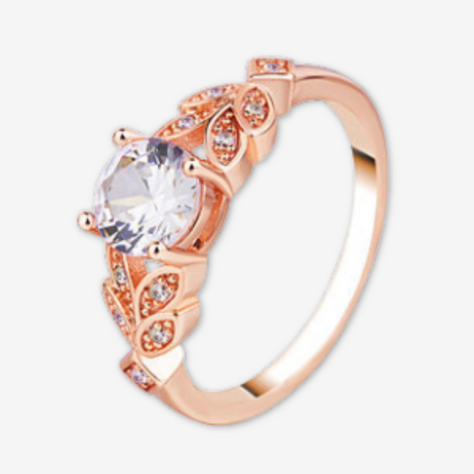 Anello oro con solitario e foglie con brillantina.
