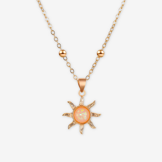 Collana con sole e madreperla centrale oro