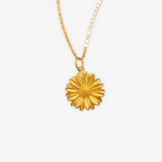 Collana dorata con pendente a forma di sole