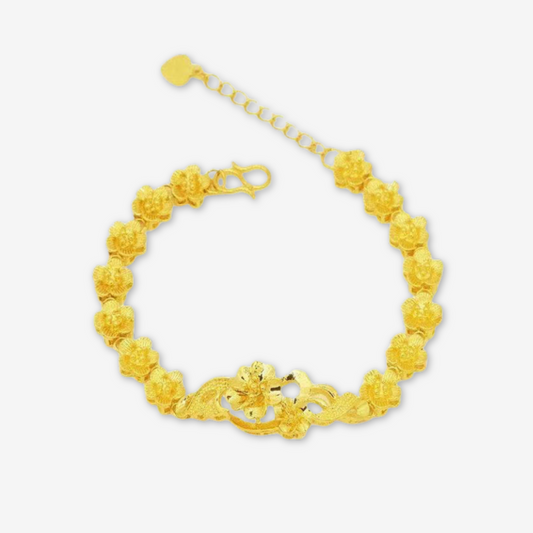 Bracciale dorata con fiore al centro e catena floreale